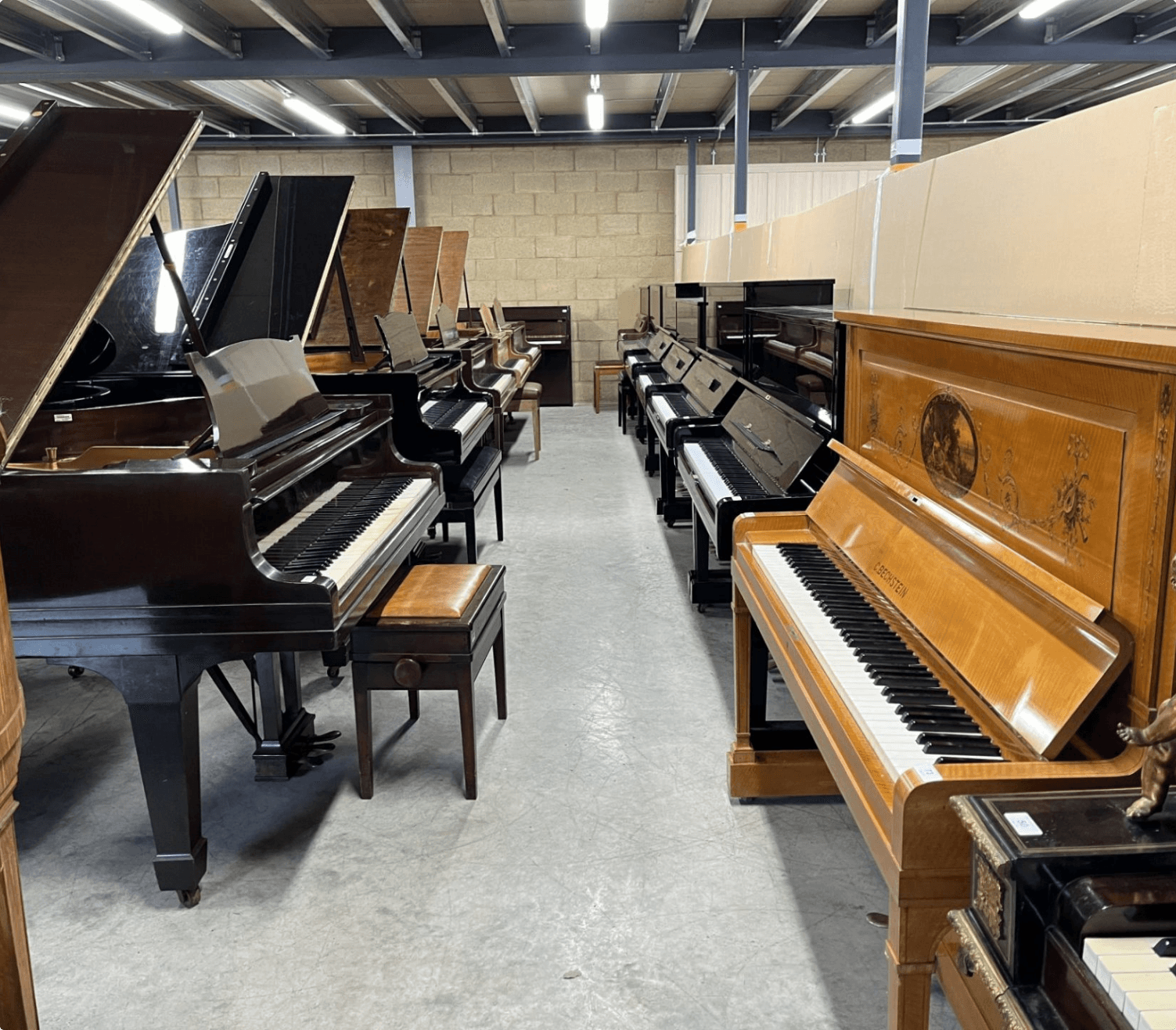 Concert grand piano in a softly lit hall