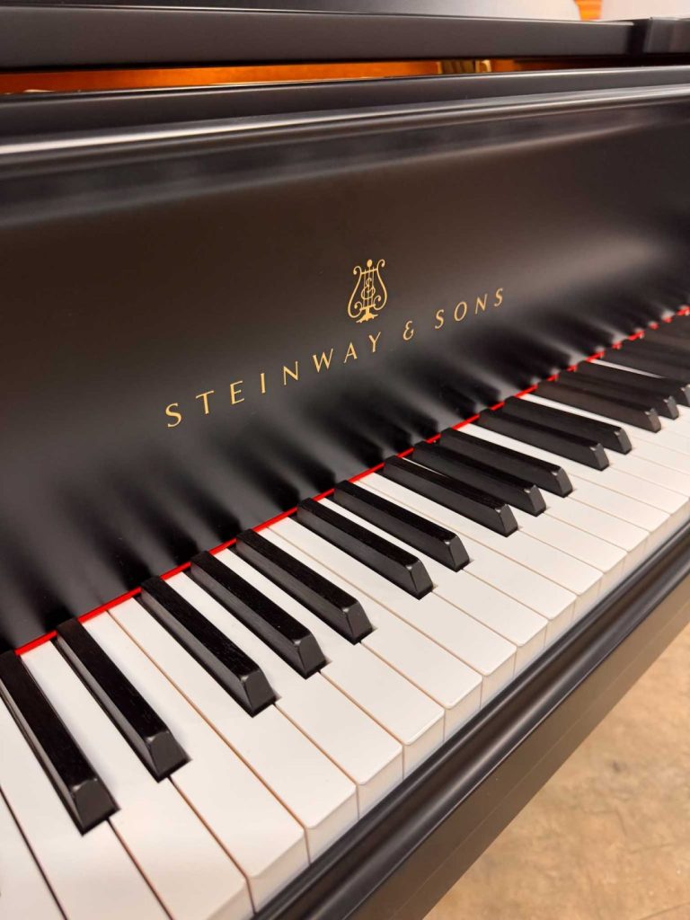 Steinway Model B grand piano fall and logo.