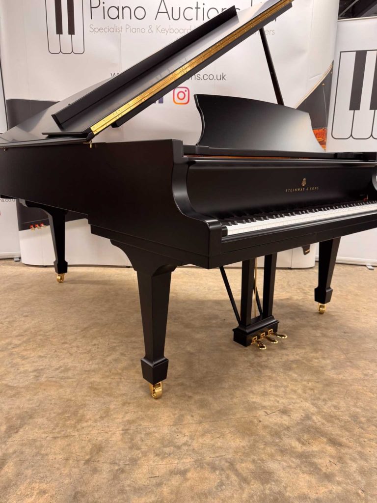 Steinway Model B grand piano cheek and leg.