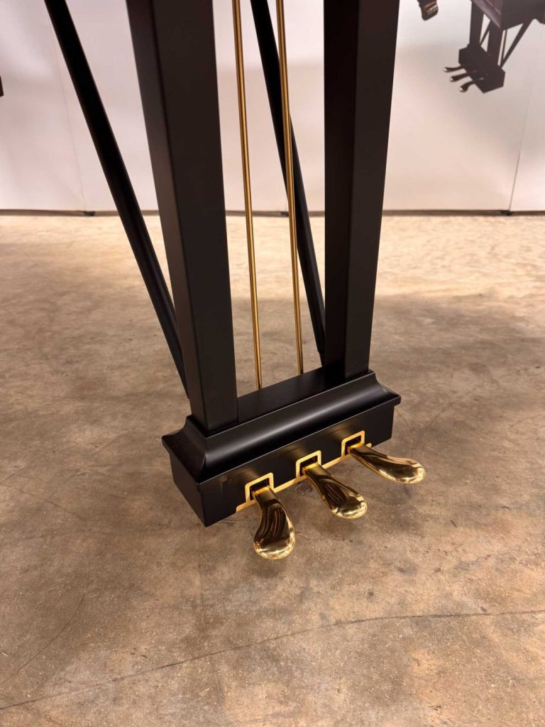 Steinway Model B grand piano lyre and pedals.